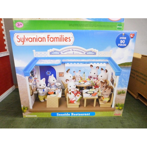 811 - A Sylvanian Families Adventure Treasure Ship and Seaside Restaurant, both boxed and two part buildin... 