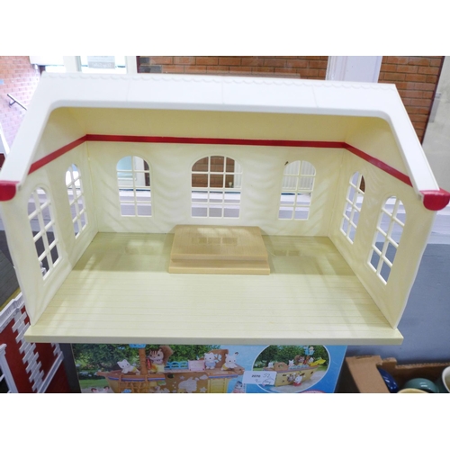 811 - A Sylvanian Families Adventure Treasure Ship and Seaside Restaurant, both boxed and two part buildin... 