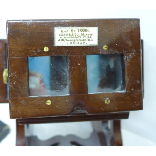 818 - A mahogany lantern slide viewer, with slide carrier and a collection of slides, the viewer marked Ad... 