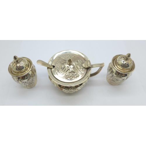 857 - A Victorian silver three piece cruet set with matching spoon, London 1894, 136.4g