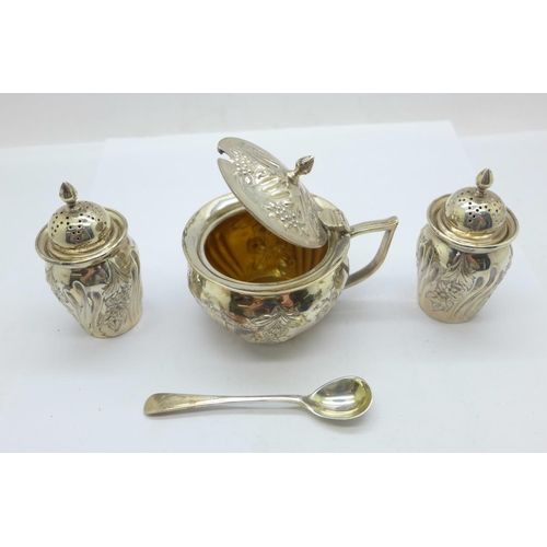 857 - A Victorian silver three piece cruet set with matching spoon, London 1894, 136.4g