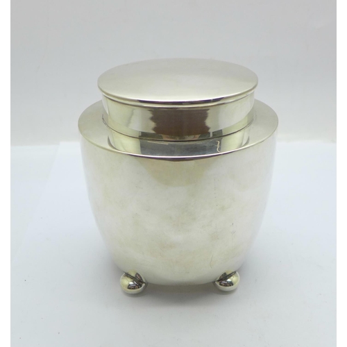 859 - A silver tea caddy with gilt interior, Birmingham 1921, 176g, (some dents)