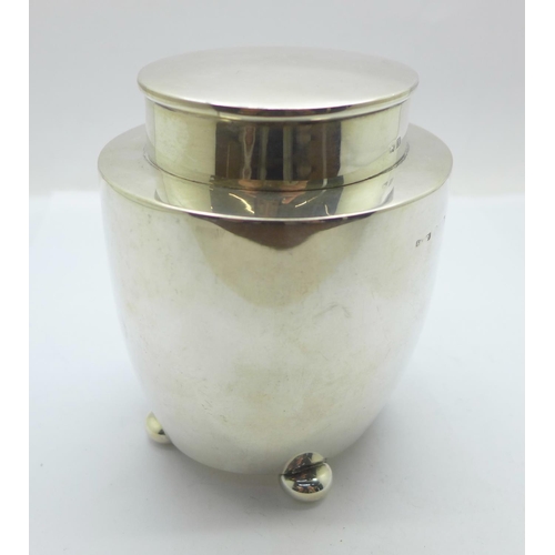 859 - A silver tea caddy with gilt interior, Birmingham 1921, 176g, (some dents)