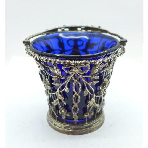 868 - A George II pierced silver sugar basket with blue glass liner, London 1759, William Vincent, height ... 