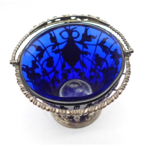 868 - A George II pierced silver sugar basket with blue glass liner, London 1759, William Vincent, height ... 