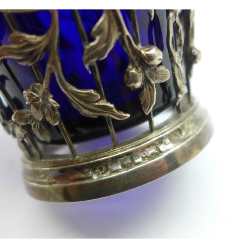 868 - A George II pierced silver sugar basket with blue glass liner, London 1759, William Vincent, height ... 