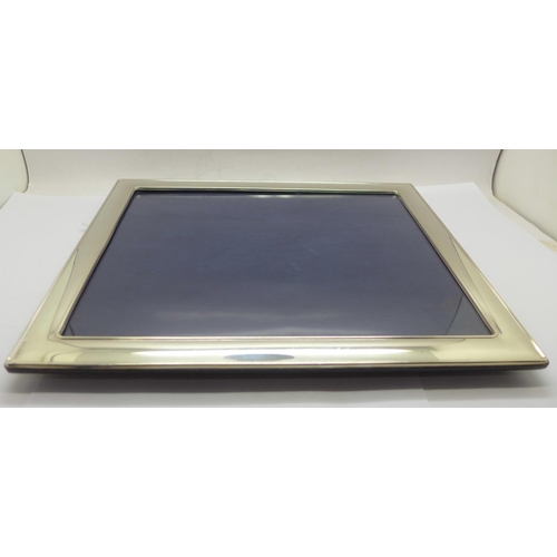 876 - A silver photograph frame, by Carrs, 24cm x 29cm