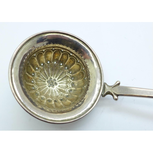 878 - A white metal sifter spoon, 55g, 20cm