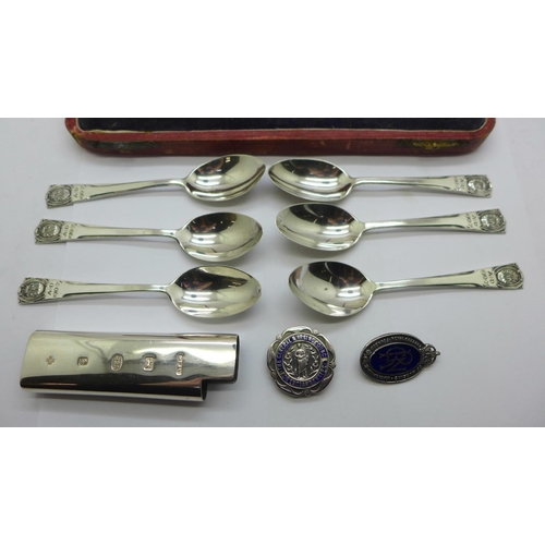 880 - A cased set of six silver handled knives, six silver commemorative spoons, a silver holder and two n... 