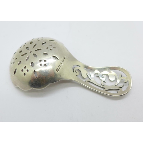 891 - A silver sifting spoon, Birmingham 1920, Lanson Ltd., 27g