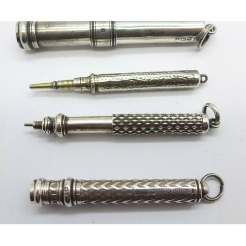 922 - A propelling pencil by Sampson Mordan & Co. and three other pencils, two hallmarked silver, one mark... 