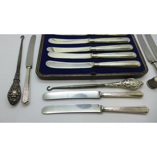 951 - A cased set of six silver handled knives, other knives, two silver handled button hooks and a silver... 