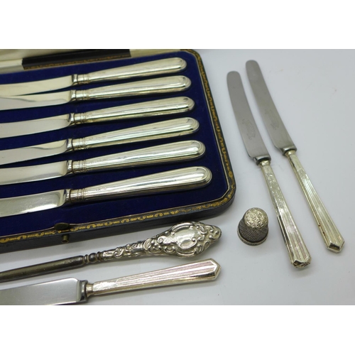 951 - A cased set of six silver handled knives, other knives, two silver handled button hooks and a silver... 