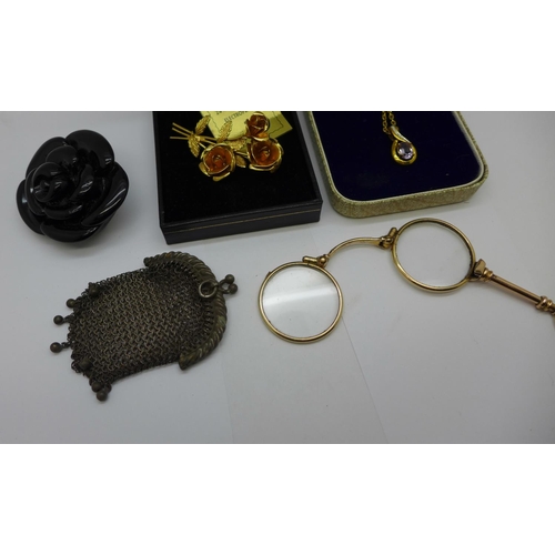 959 - A small mesh purse, a pair of plated lorgnettes, a pendant and chain, a plated brooch and one other ... 