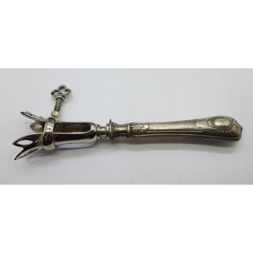 971 - A French early 20th Century meat holder, the silver covered handle with French control mark, the cas... 