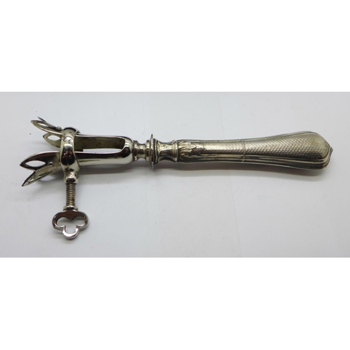 971 - A French early 20th Century meat holder, the silver covered handle with French control mark, the cas... 