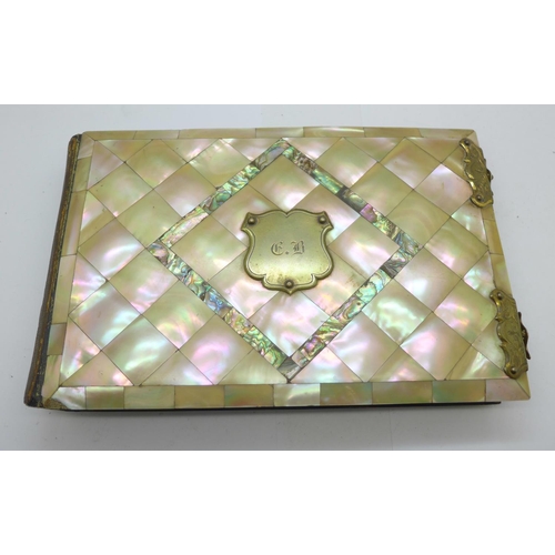 979 - A late Victorian photograph album with mother of pearl and abalone cover, 23.5cm x 15cm, (some mothe... 