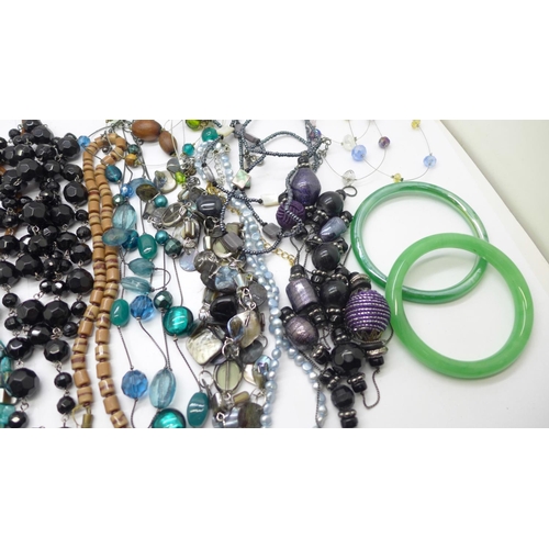 982 - A collection of glass bead jewellery and two jade bangles