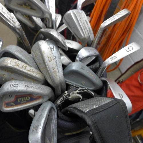 2342 - 4 Bags of various golf irons & woods inc. Donnay, Dunlop, Daytona, Penn, etc.