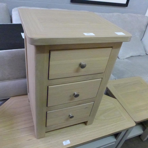 1363 - A Chichester three drawer bedside chest,marks to front edge.