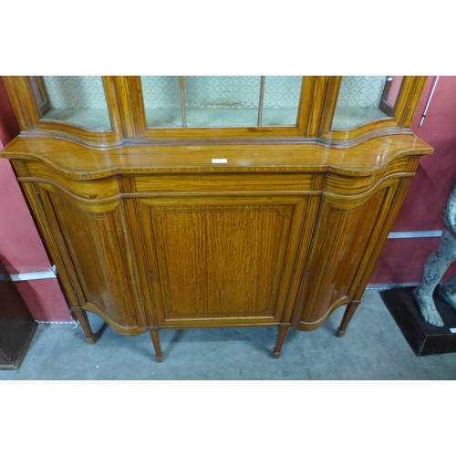 95 - A late Victorian Sheraton Revival inlaid satinwood display cabinet, 224cms h, 126cms w, 45cms d.