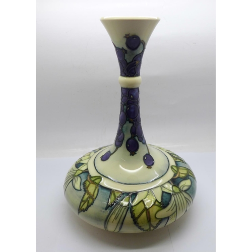 611 - A Moorcroft Juneberry vase, designed by Angela Davenport, signed on the base, 24cm, boxed