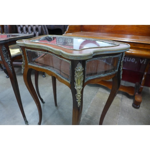 103 - A pair of French Louis XV style mahogany and gilt metal bijouterie tables