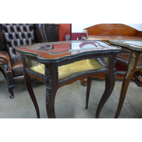 103 - A pair of French Louis XV style mahogany and gilt metal bijouterie tables