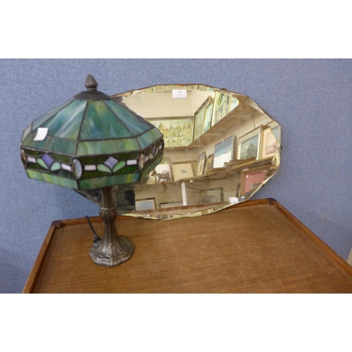 466 - A bevelled edge mirror and a Tiffany style lamp