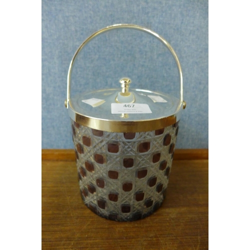 467 - A white metal and glass biscuit barrel