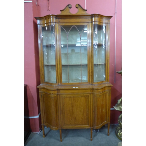 95 - A late Victorian Sheraton Revival inlaid satinwood display cabinet, 224cms h, 126cms w, 45cms d.