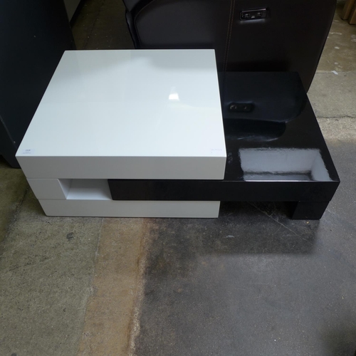 1540 - A high gloss monochrome adjustable coffee table