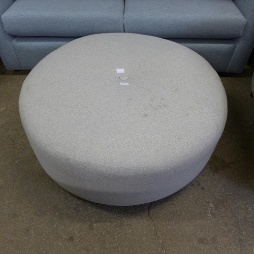 1552 - A large circular grey upholstered pouffe (marked)