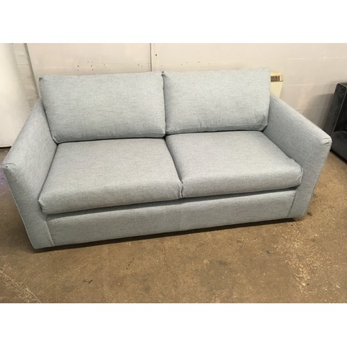 1563 - A sky blue upholstered sofa bed