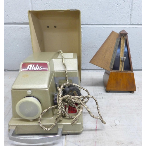 1180 - A vintage Maelzel metronome and an Aldis 35mm slide projector **PLEASE NOTE THIS LOT IS NOT ELIGIBLE... 