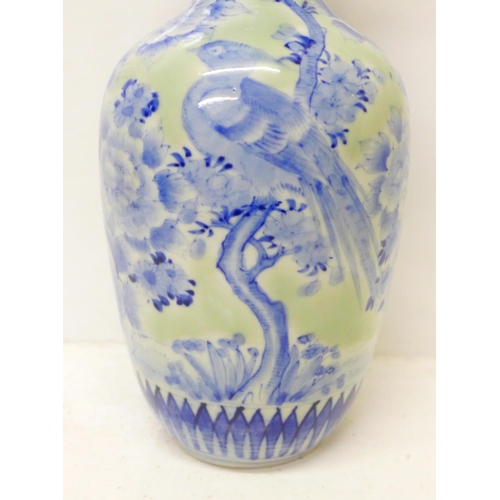 601 - A 19th Century Chinese blue and white vase, small chip to rim, 25cm