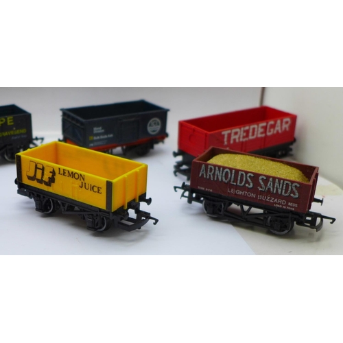 690 - Twelve OO gauge railway wagons including Hornby