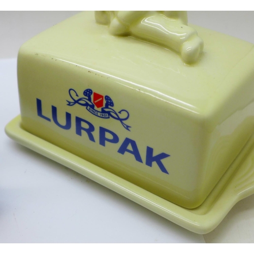 691 - A collection of toast racks, Lurpak and Marmite and a Lurpak butter dish