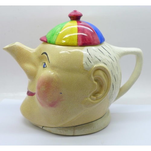 703 - A Devonmoor Pottery (1923 to 1981) novelty teapot, in the form of Simple Simon, DS initials on the b... 