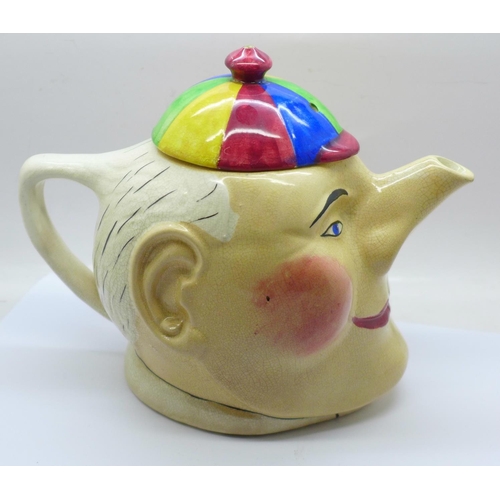 703 - A Devonmoor Pottery (1923 to 1981) novelty teapot, in the form of Simple Simon, DS initials on the b... 