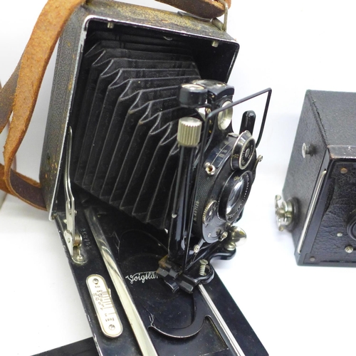 716 - A Voitlander camera with Compur shutter and seven plates; Anastigmat Lukos II, cased, Kodak Brownie ... 