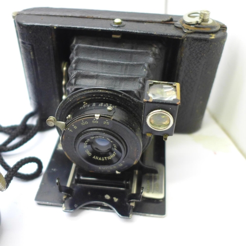 716 - A Voitlander camera with Compur shutter and seven plates; Anastigmat Lukos II, cased, Kodak Brownie ... 