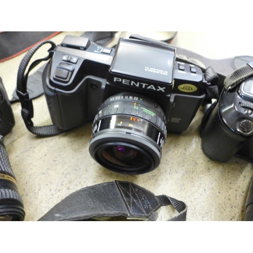 727 - Four cameras, Pentax SFX and three Canon including EOS1000F and EOS 400D