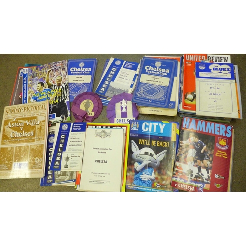 740 - A collection of football programmes, including 1950's Chelsea, some 1949, two Chelsea rosettes and o... 