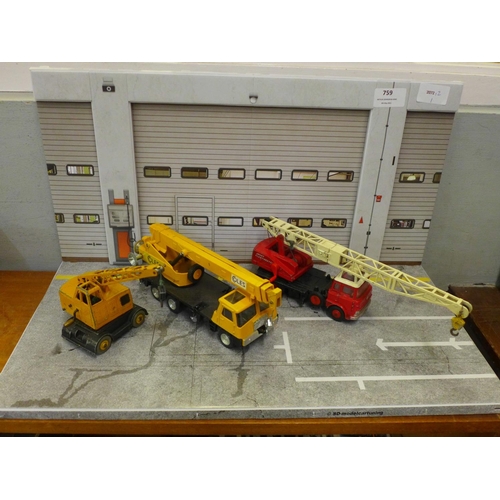 759 - Three Dinky Toys model cranes diorama, comprising Jones Fleetmaster, Coles Hydra Truck and Coles Mob... 