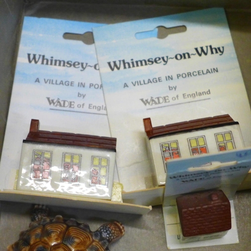 772 - A collection of Wade houses, whimsies and tortoises and a collectors book