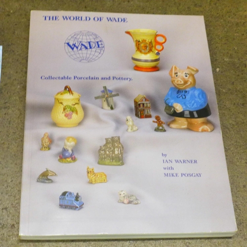 772 - A collection of Wade houses, whimsies and tortoises and a collectors book