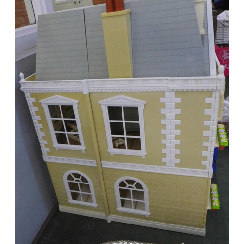 781 - A large plastic doll's house with furniture