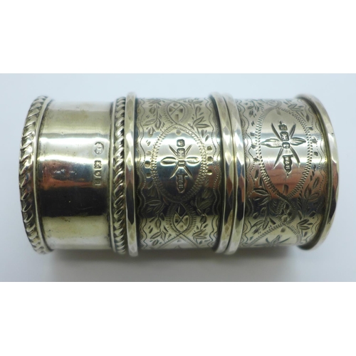 923 - Four silver napkin rings, including a pair by Walker & Hall, 89g