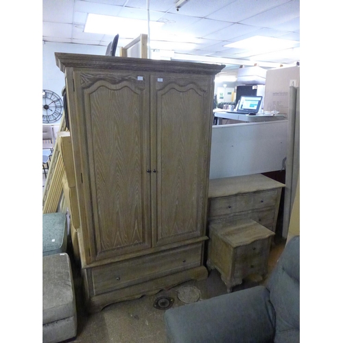 1614 - A French oak bedroom suite including a three drawer chest, a two drawer bedside chest and a two door... 